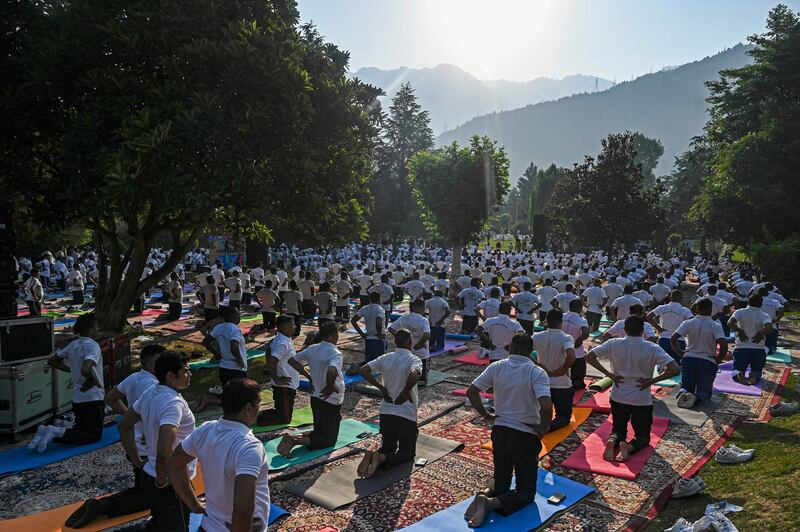Practitioners take part in a yoga session in Srinagar. AFP