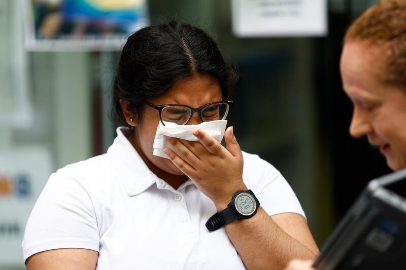 Hasena Mahmood is overcome by emotion after receiving her results at City of London College. Getty Images