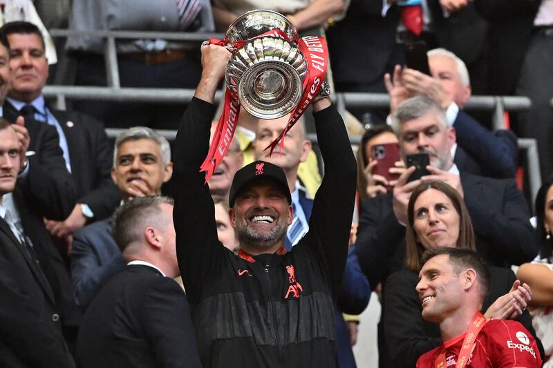 Liverpool manager Jurgen Klopp celebrates with the trophy. AFP
