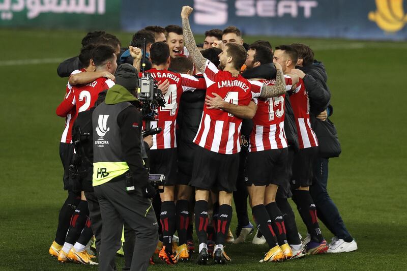 Athletic Bilbao's players celebrate winning the Spanish Super Cup semi final. EPA