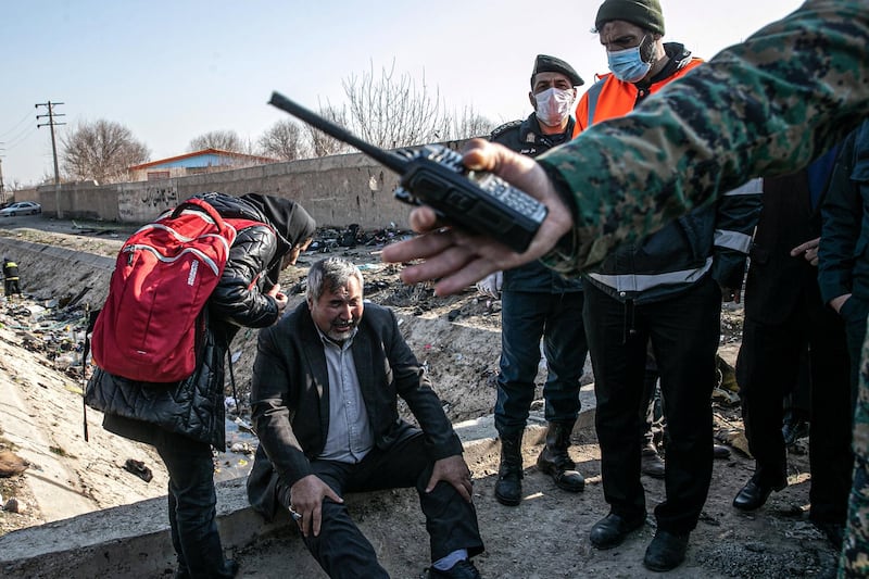 08 January 2020, Iran, Shahedshahr: A man cries at the scene, where a Ukrainian airplane carrying 176 people crashed on Wednesday shortly after takeoff from Tehran airport, killing all onboard. Photo: Foad Ashtari/dpa (Photo by Foad Ashtari/picture alliance via Getty Images)
