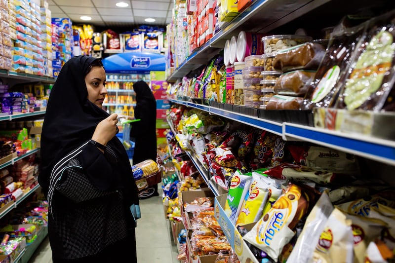 Women browse food products in a grocery store in Jeddah, Saudi Arabia, on Sunday, Aug. 6, 2017. After relying on oil to fuel its economy for more than half a century, Saudi Arabia is turning to its other abundant natural resource to take it beyond the oil age -- desert. Photographer: Tasneem Alsultan/Bloomberg