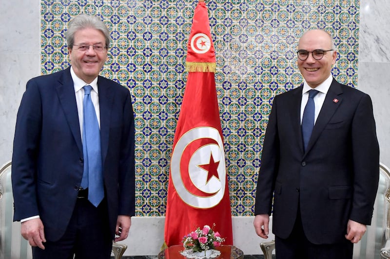 Tunisian Foreign Minister Nabil Ammar, right, with European Commissioner for Economy Paolo Gentiloni in Tunis on Monday. AFP