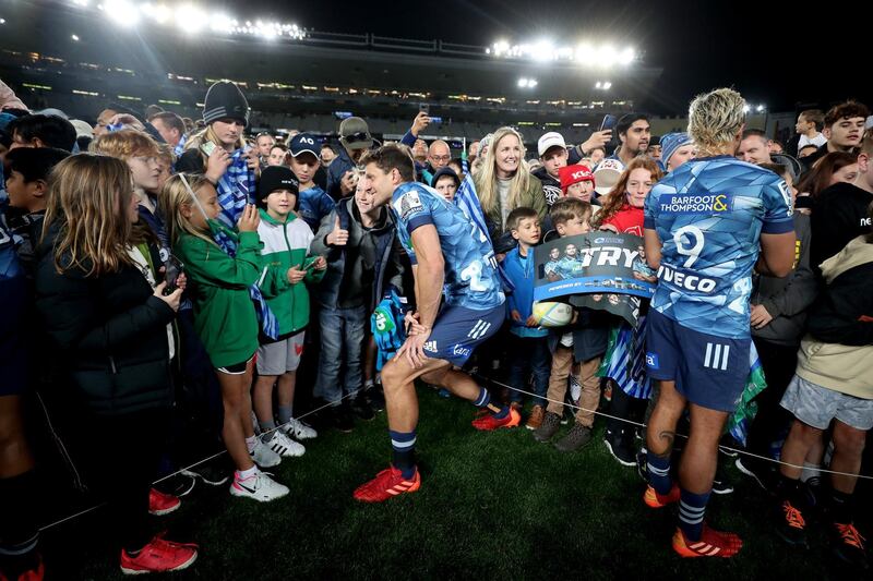 Matt Duffie of the Blues signs autographs at Eden Park on Sunday. Getty