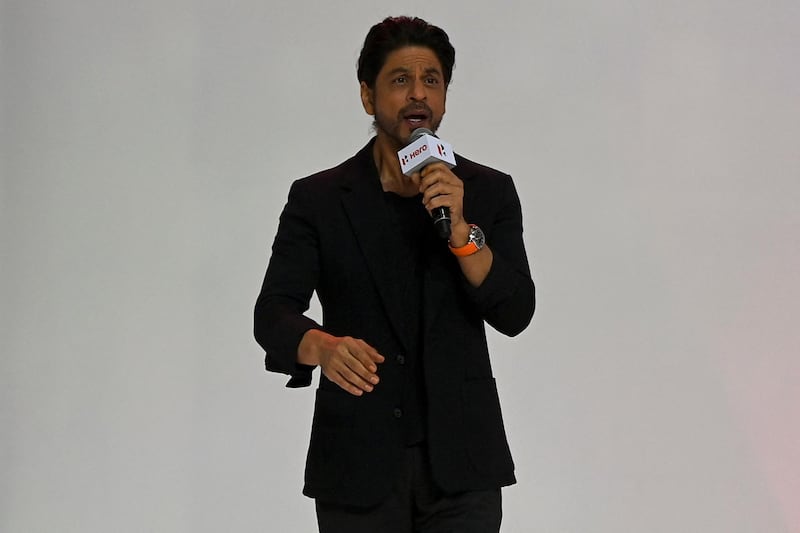 Bollywood actor Shah Rukh Khan speaks during the unveiling of the company's 100 millionth motorcycle, in Gurgaon on January 21, 2021. (Photo by Money SHARMA / AFP)