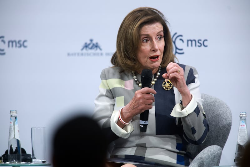 US Representative and former speaker Nancy Pelosi in conversation. Getty Images