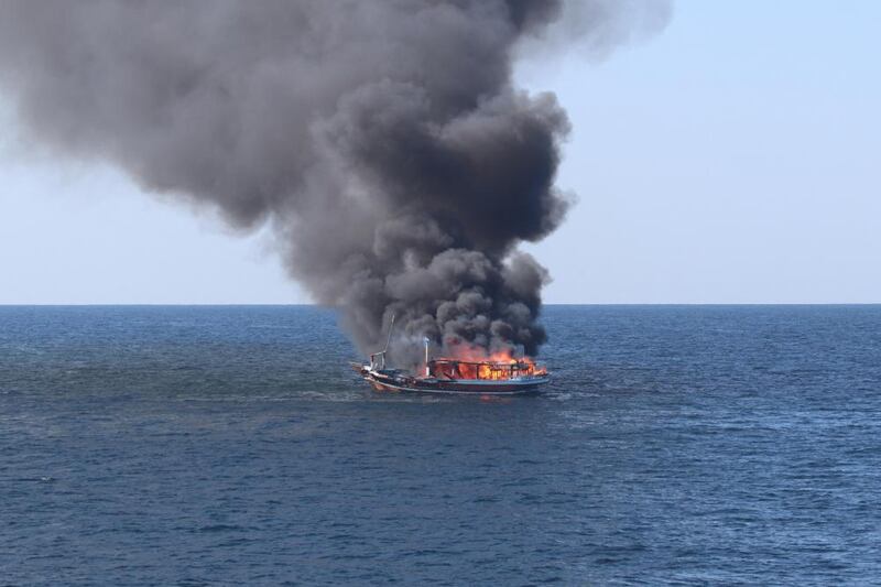 A fire rages after an explosion aboard a fishing vessel in the Gulf of Oman. AFP