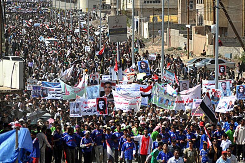 emeni protesters march in Sanaa yesterday to demand the trial of President Ali Abdullah Saleh.