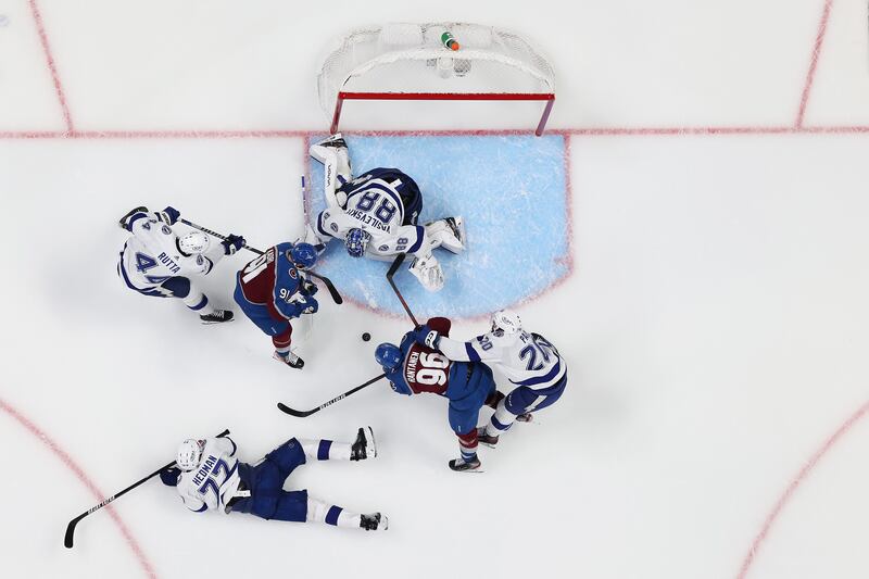 Kadri tries to score while defended by Tampa Bay Lightning players. AFP
