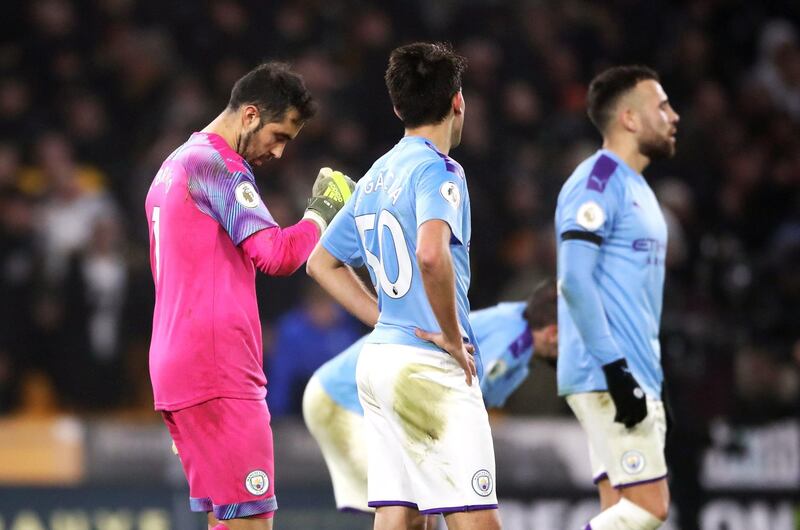 Manchester City goalkeeper Claudio Bravo (left) and team-mates look dejected. PA