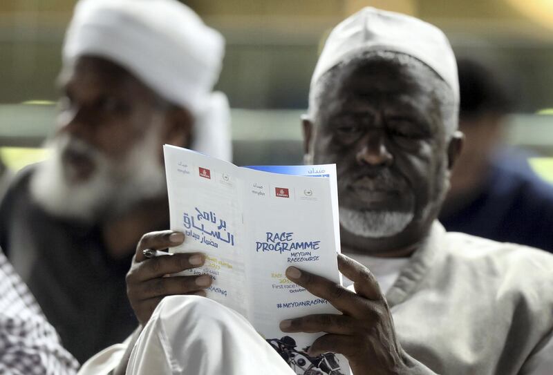 Dubai, United Arab Emirates - October 24, 2019: A man studies the form for the first race on the opening meeting of the new season. Thursday the 24th of October 2019. Meydan Racecourse, Dubai. Chris Whiteoak / The National