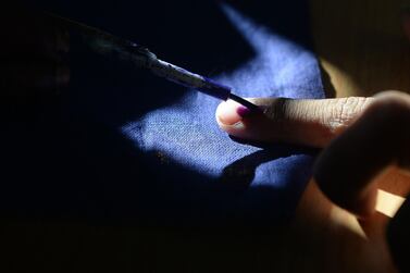 An Indian voter gets his finger marked with ink as he votes at a polling station in Chennai, during the second phase of the mammoth Indian elections. AFP