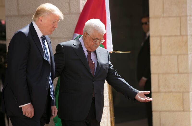 Palestinian Authority President Mahmud Abbas and US President Donald Trump are seen during a welcome ceremony at the Presidential Palace in Bethlehem on May 23, 2017. (Photo by FADI AROURI / POOL / AFP)