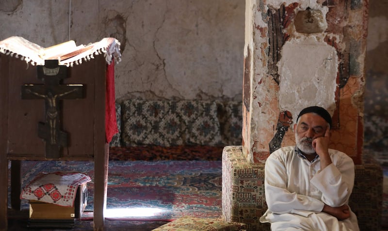 Monk Youssef Al Halabi sits in prayer and contemplation at Deir Mar Moussa Al Habashi.