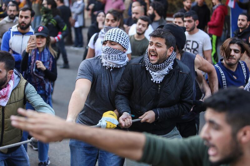 A demonstrator pulls a rope during the ongoing anti-government protest, in Beirut. Reuters