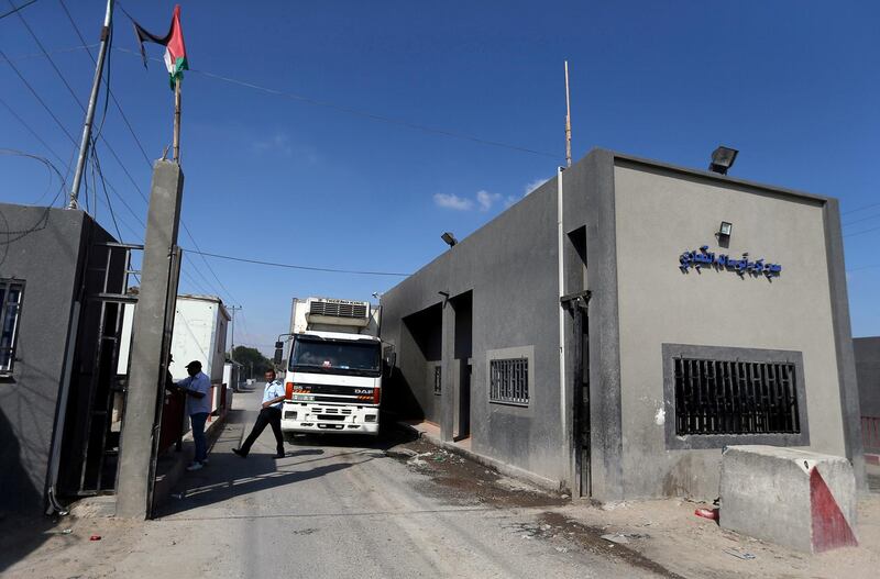 FILE PHOTO: A truck carrying food products arrives at Kerem Shalom crossing in Rafah in the southern Gaza Strip July 10, 2018. REUTERS/Ibraheem Abu Mustafa/File Photo