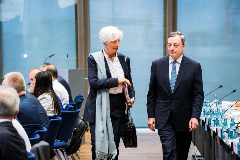 Christine Lagarde, managing director of the International Monetary Fund (IMF), left, arrives with Mario Draghi, president of the European Central Bank (ECB), at the central, eastern and south-eastern European economies (CESEE) conference at the ECB headquarters in Frankfurt, Germany, on Wednesday, June 12, 2019. Lagarde called on governments to de-escalate current trade disputes and instead work to fix the global system. Photographer: Andreas Arnold/Bloomberg