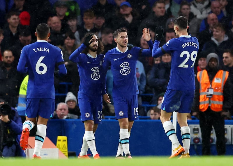 Mason Mount celebrates scoring their second with Kai Havertz, Marc Cucurella and Thiago Silva. Reuters