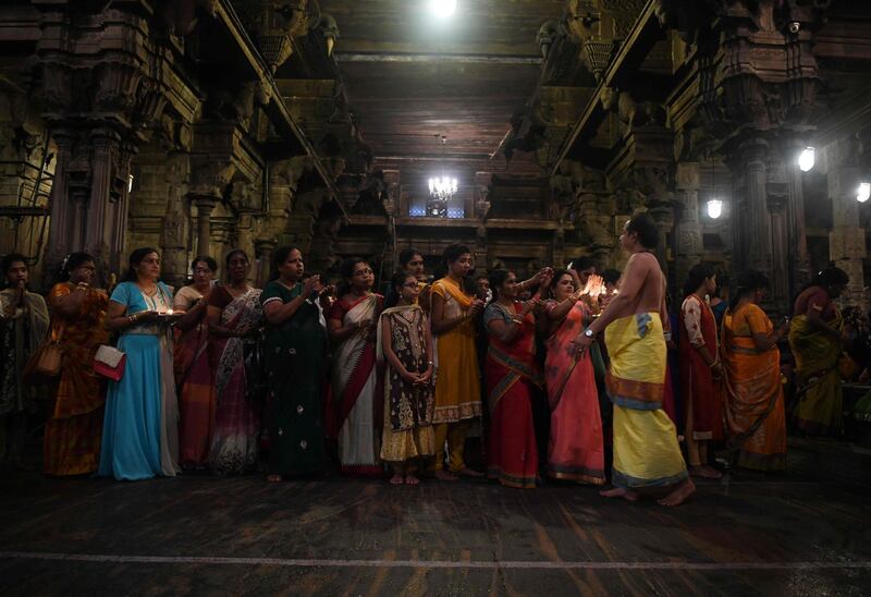 Sri Lankan Hindu devotees offer prayers during Diwali Festival at a temple in Colombo. AFP