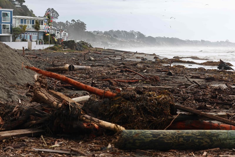 Storm debris near homes along the beach in Aptos. Getty / AFP