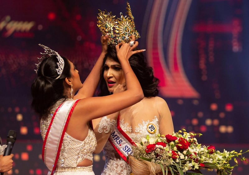 Reigning Mrs World Caroline Jurie, forcibly removes the Mrs Sri Lanka winner Pushpika De Silva's crown as Jurie declared that the winner was ineligible because she was divorced, during the Mrs Sri Lanka pageant, in Colombo, Sri Lanka April 4, 2021. Picture taken April 4, 2021. REUTERS/Gimhana Pathirana