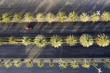 TOPSHOT - An aerial view shows a section of the nearly-deserted King Fahad road due to the COVID-19 pandemic, on the first day of the Eid al-Fitr feast marking the end of the Muslim holy month of Ramadan, in the Saudi capital Riyadh, on May 24, 2020. Saudi Arabia, home to Islam's holiest sites, began a five-day round-the-clock curfew from May 23, in a bid to stem the spread of the novel coronavirus. / AFP / FAISAL AL-NASSER