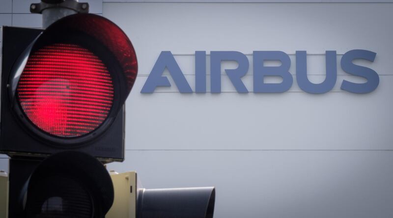 epa08390573 (FILE) - The airbus logo is seen next to a red traffic light on the main entrance building of the Airbus group plant in Bremen, northern Germany, 07 March 2018 (reissued 29 April 2020). Airbus posted its Q1 results on 29 April, reporting a loss of 481 million Euro amid the ongoing coronavirus pandemic and its effect on the airline industry worldwide.  EPA/FOCKE STRANGMANN