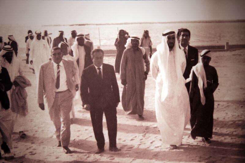 Founding Father Sheikh Zayed, Capt Al Deeb and others take a beach walk in Abu Dhabi. Capt Al Deeb’s daughter Nora said the story of the flying school began with this picture.