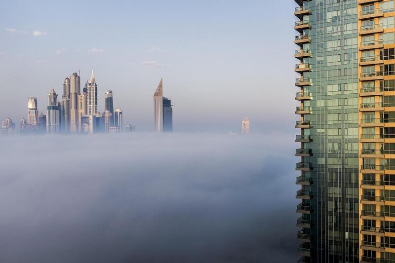 Early morning fog around the Dubai Marina area on December 30, 2014. Antonie Robertson / The National