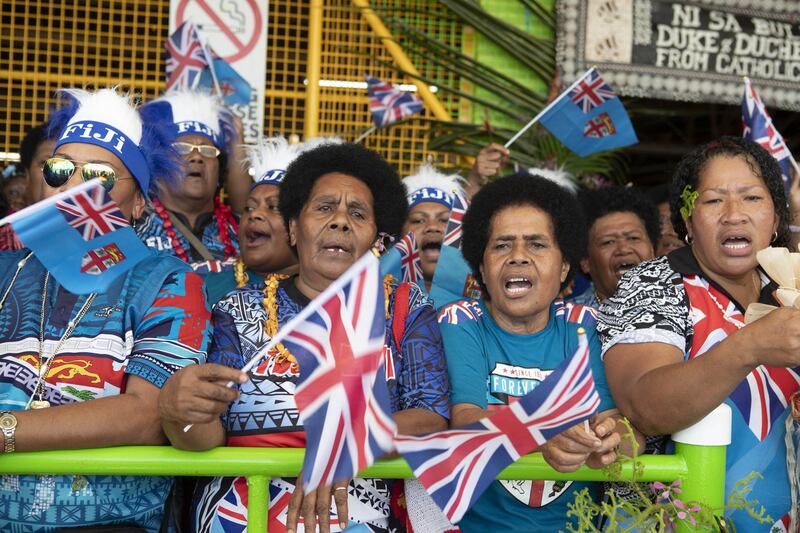 People cheer as Meghan, Duchess of Sussex, visits a market on October 24, 2018 in Suva, Fiji. Getty Images