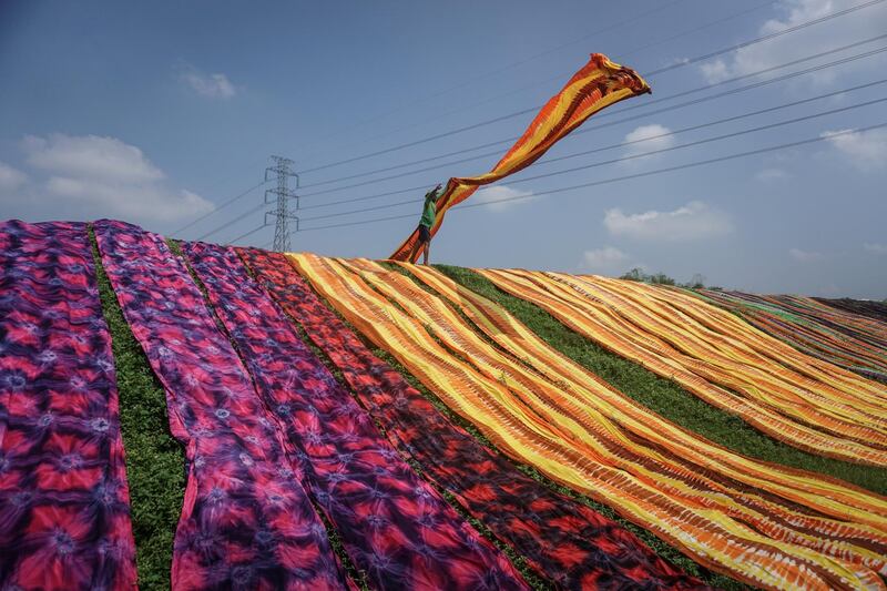 A worker throws a cloth during a drying process at Sukoharjo near Solo, Central Java province, Indonesia. Reuters