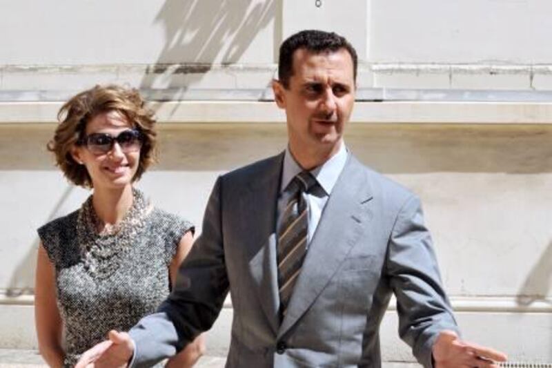 Syrian President Bashar al-Assad (R) and his wife Asma (L) arrive at the Elysee palace on July 14, 2008 in Paris, to attend the traditional garden party as part the celebration of the Bastille Day. France kicked off Bastille Day celebrations in a whirlwind of controversy as Syrian President Bashar al-Assad joined dozens of leaders to watch the Champs Elysees military parade. AFP PHOTO DOMINIQUE FAGET
