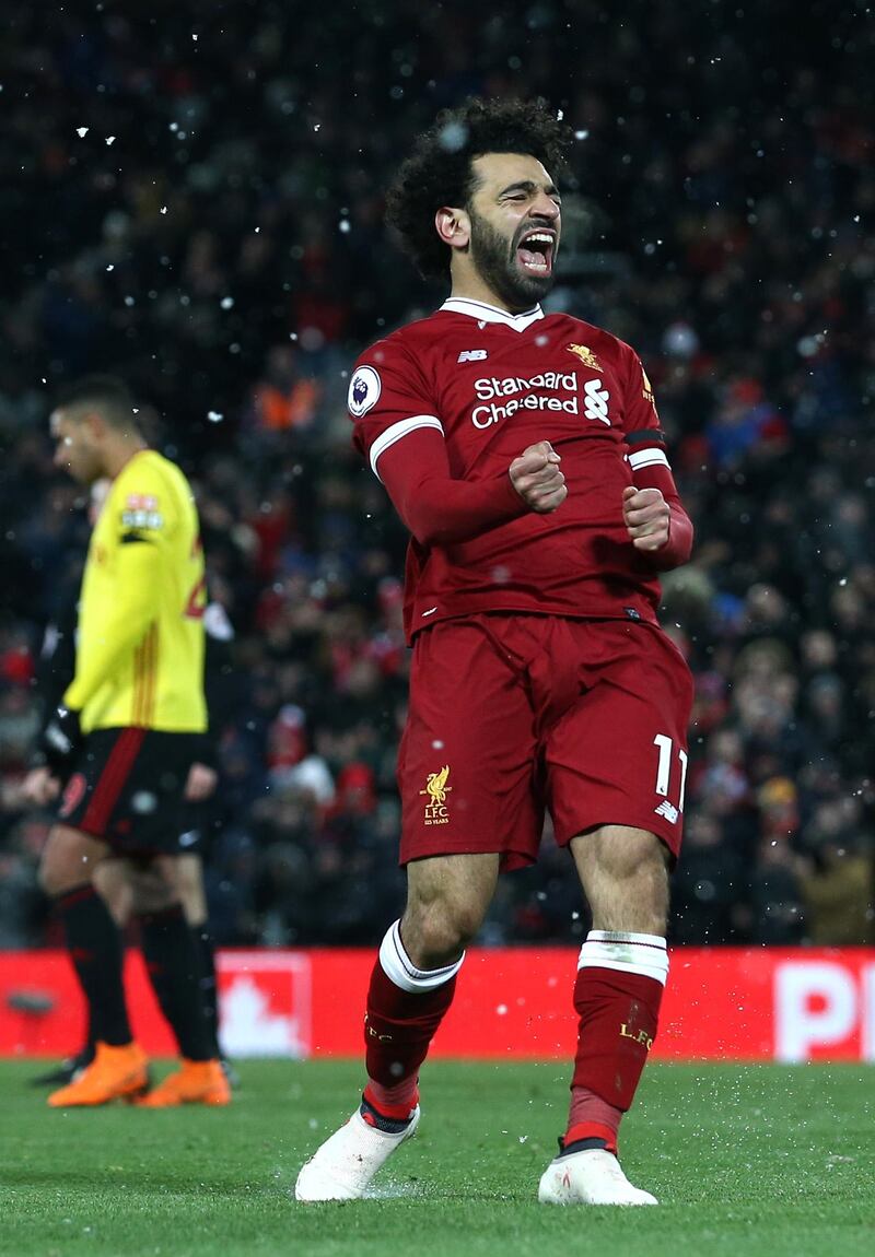 LIVERPOOL, ENGLAND - MARCH 17:  Mohamed Salah of Liverpool celebrates scoring his side's fourth goal during the Premier League match between Liverpool and Watford at Anfield on March 17, 2018 in Liverpool, England.  (Photo by Jan Kruger/Getty Images)