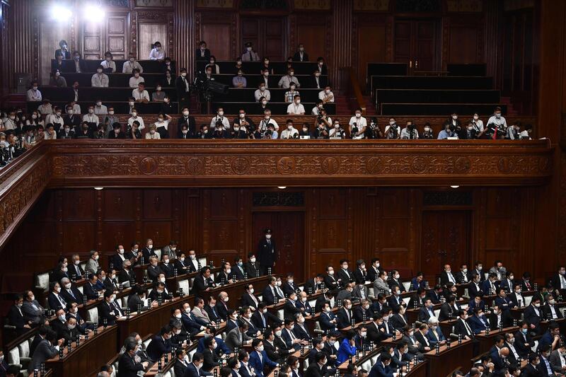 Lower House lawmakers wait for the results after voting to elect a new prime minister at the parliament in Tokyo. AFP