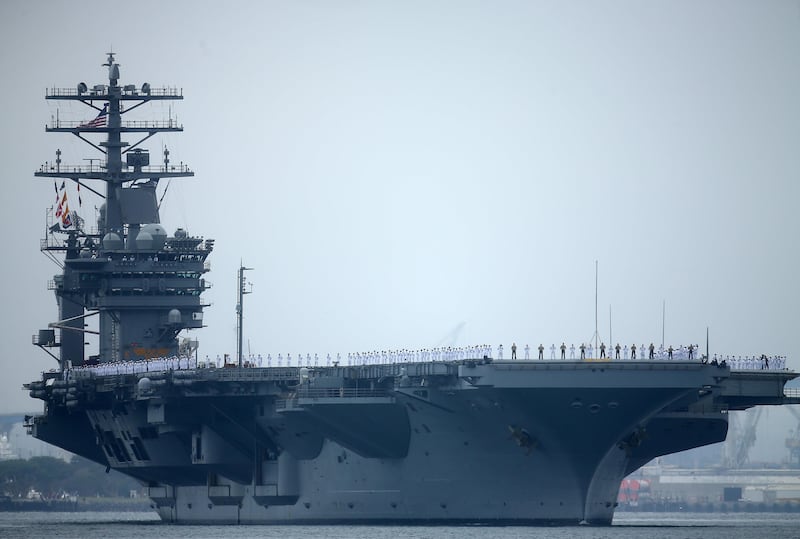 FILE PHOTO - Sailors man the rails as aircraft carrier USS Nimitz with Carrier Strike Group 11, and some 7,500 sailors and airmen depart for a 6 month deployment in the Western Pacific from San Diego, California, U.S., June 5, 2017. REUTERS/Mike Blake/File Photo