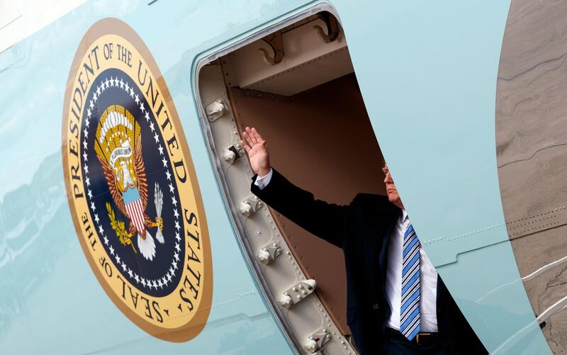 FILE - In this March 23, 2018, file photo, President Donald Trump waves as he boards Air Force One at Andrews Air Force Base, Md., en route to Palm Beach International Airport, in West Palm Beach, Fla. (AP Photo/Carolyn Kaster, File)