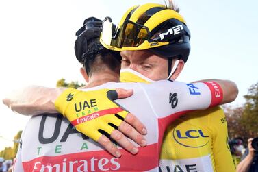 epa08684667 Slovenian rider Tadej Pogacar of UAE-Team Emirates in the overall leader's yellow jersey reacts after the 21st and last stage of the Tour de France 2020 cycling race over 122km from Mantes-La-Jolie to Paris, France, 20 September 2020. EPA/STEPHANE MANTEY/ POOL