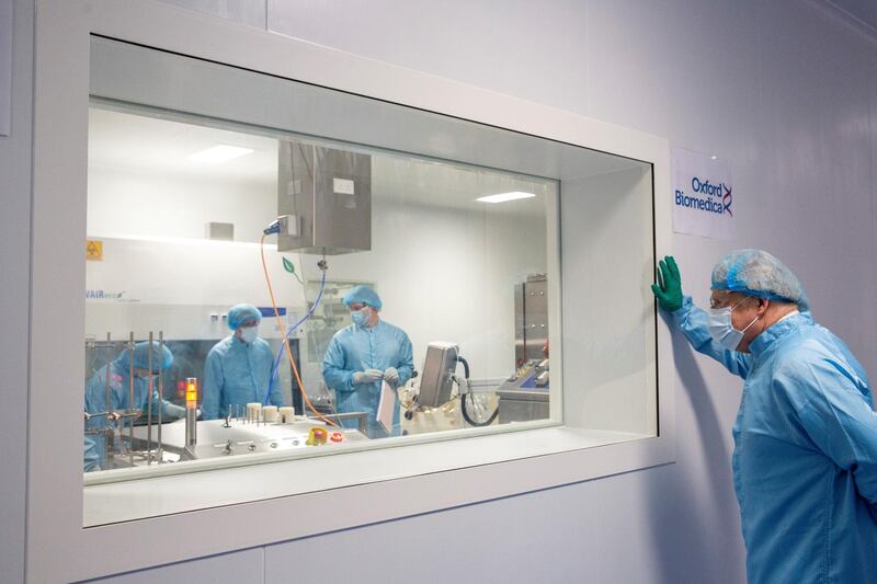 UK Prime Minister Boris Johnson watches technicians manufacturing the AstraZeneca vaccine at Oxford Biomedica in Oxford, England. Reuters