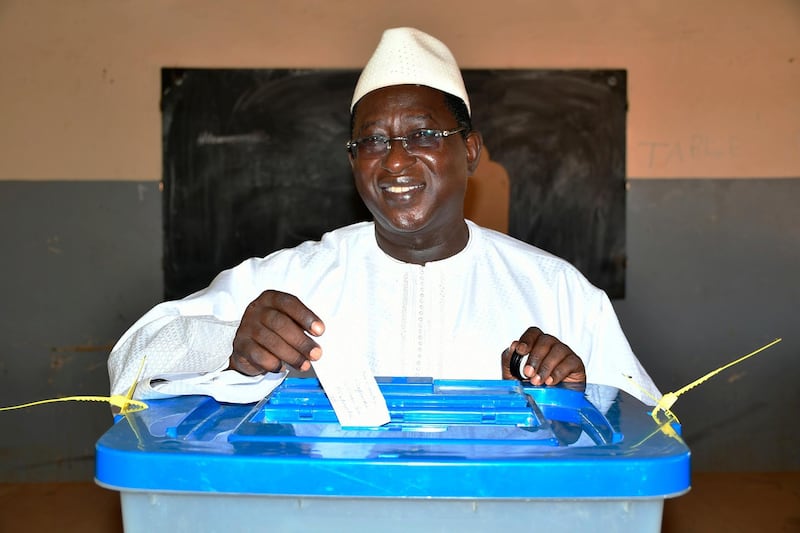 In this photo released by the Union for the Republic and Democracy party, showing Soumaila Cisse, opposition presidential candidate casting his ballot during the Presidential second round election in Niafunke, Mali, Sunday, Aug 12, 2018. Malians are voting Sunday in a second round presidential run-off vote between incumbent Ibrahim Boubacar Keita and opposition leader Soumaila Cisse. (Boubacar Sada Sissoko/Union for the Republic and Democracy via AP)