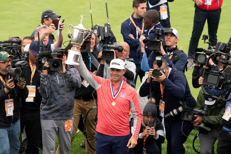 FILE PHOTO: Jun 16, 2019; Pebble Beach, CA, USA; Gary Woodland hoists the trophy after the final round of the 2019 U.S. Open golf tournament at Pebble Beach Golf Links. Mandatory Credit: Kyle Terada-USA TODAY Sports/File Photo