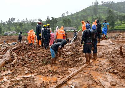 Rescuers remove debris as they search for victims of a landslide caused by torrential monsoon rains in Meppadi in Wayanad district in the southern Indian state of Kerala, India, August 10, 2019. REUTERS/Stringer NO ARCHIVES. NO RESALES.