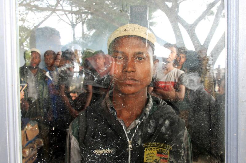 Rohingya muslims occupy a room at Kuala Idi Rayeuk port after arriving on a wooden boat in Aceh Timur, Indonesia. Reuters