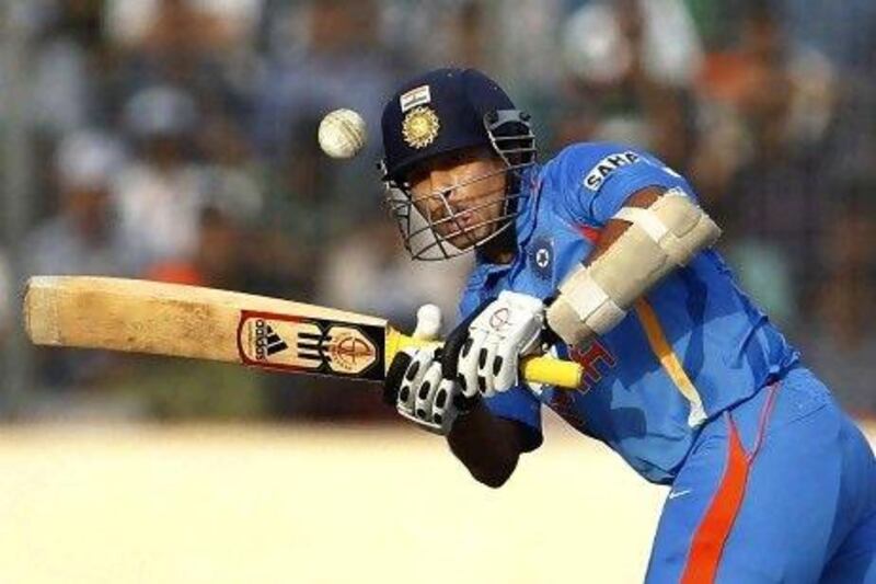 Sachin Tendulkar, the India opening batsman, strokes a boundary en route to his 100th international century in Mirpur yesterday. Forty-nine of his hundreds have come in one-day internationals. Aijaz Rahi / AP Photo