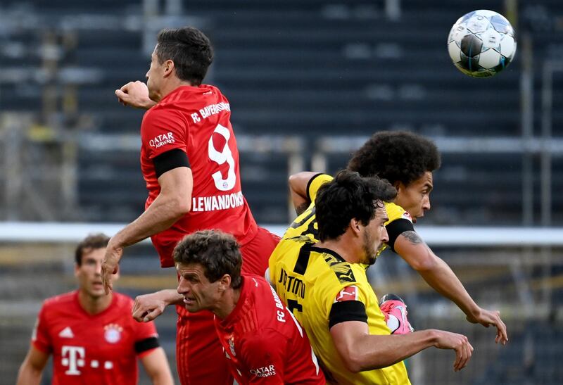 Robert Lewandowski of Bayern Munich in action against Dortmund's Mats Hummels and Axel Witsel. EPA