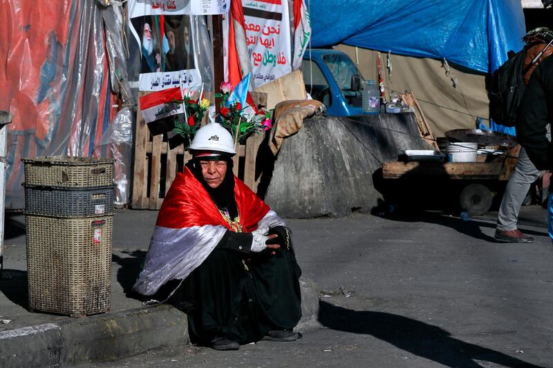 A woman takes part in the ongoing anti-government protests in Tahrir Square, Baghdad. AP Photo