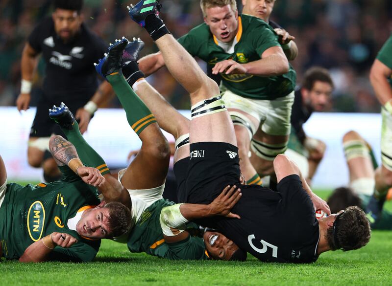 South Africa's Damian Willemse tackles New Zealand's Jordie Barrett. Reuters