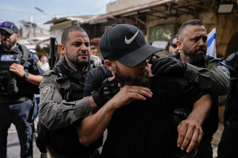 Israeli police push away Palestinians from a street in the Muslim Quarter of Jerusalem's Old City. AP Photo