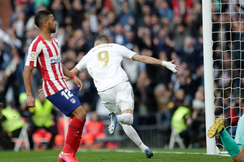 Real Madrid's Karim Benzema celebrates after scoring his side's first goal against Atletico Madrid at the Santiago Bernabeu. AP