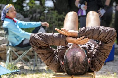 Ali Kedami and Nayla Cortas take rest in the Tannourine Cedar reserve, Lebanon. Matt Kynaston for The National