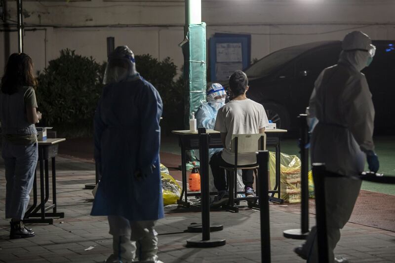 Covid-19 testing is under way at a Shanghai neighbourhood. Bloomberg